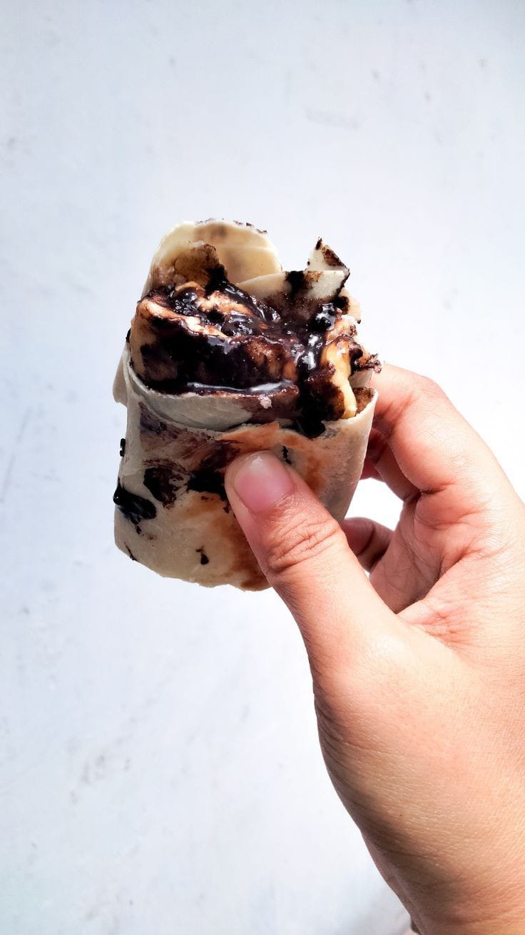 Shallow focus photography of pancake with strawberries and blueberries on top